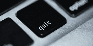 Close up of a computer keyboard with a button saying quit